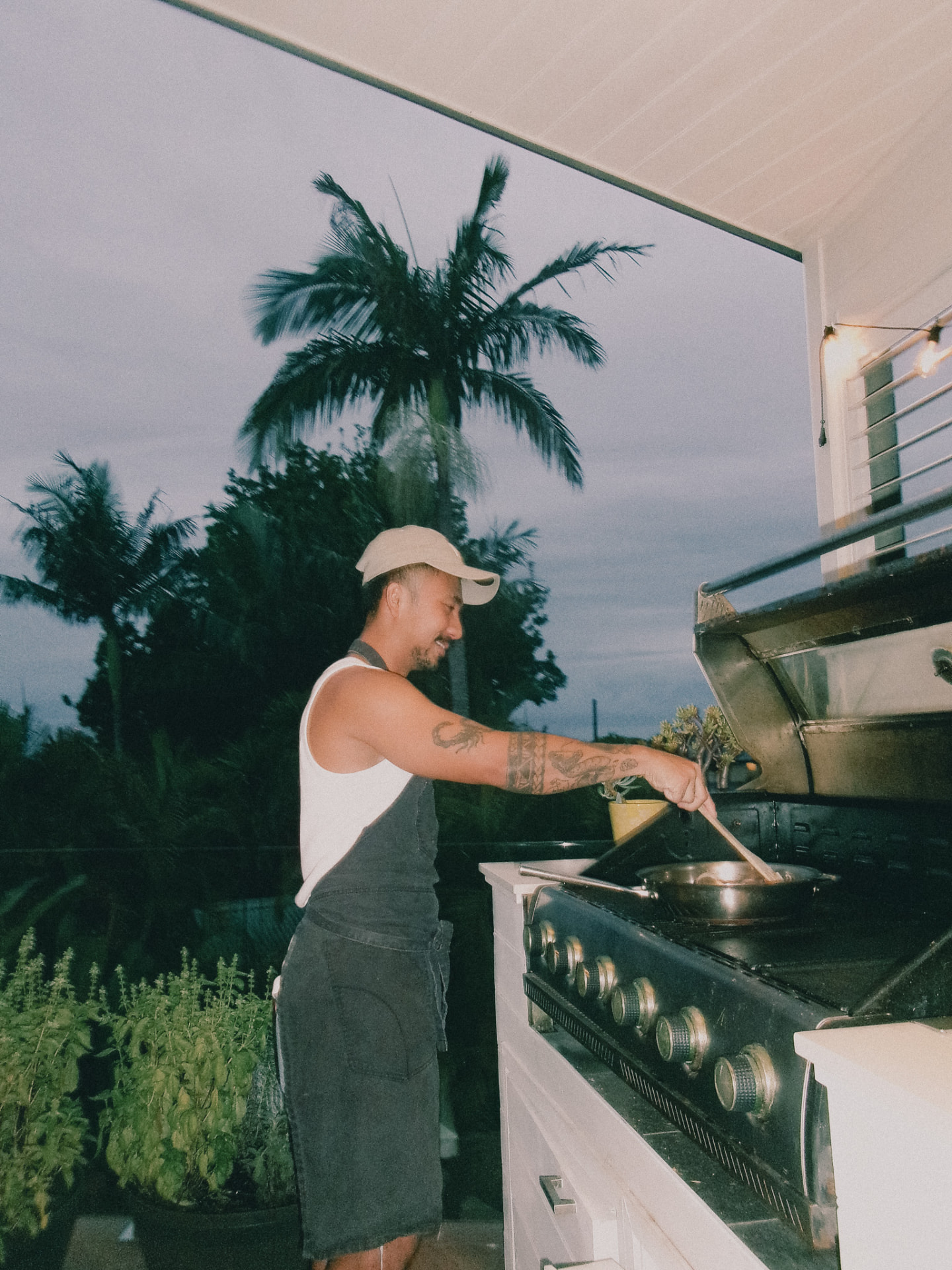 A wok over open flame as the sky turns