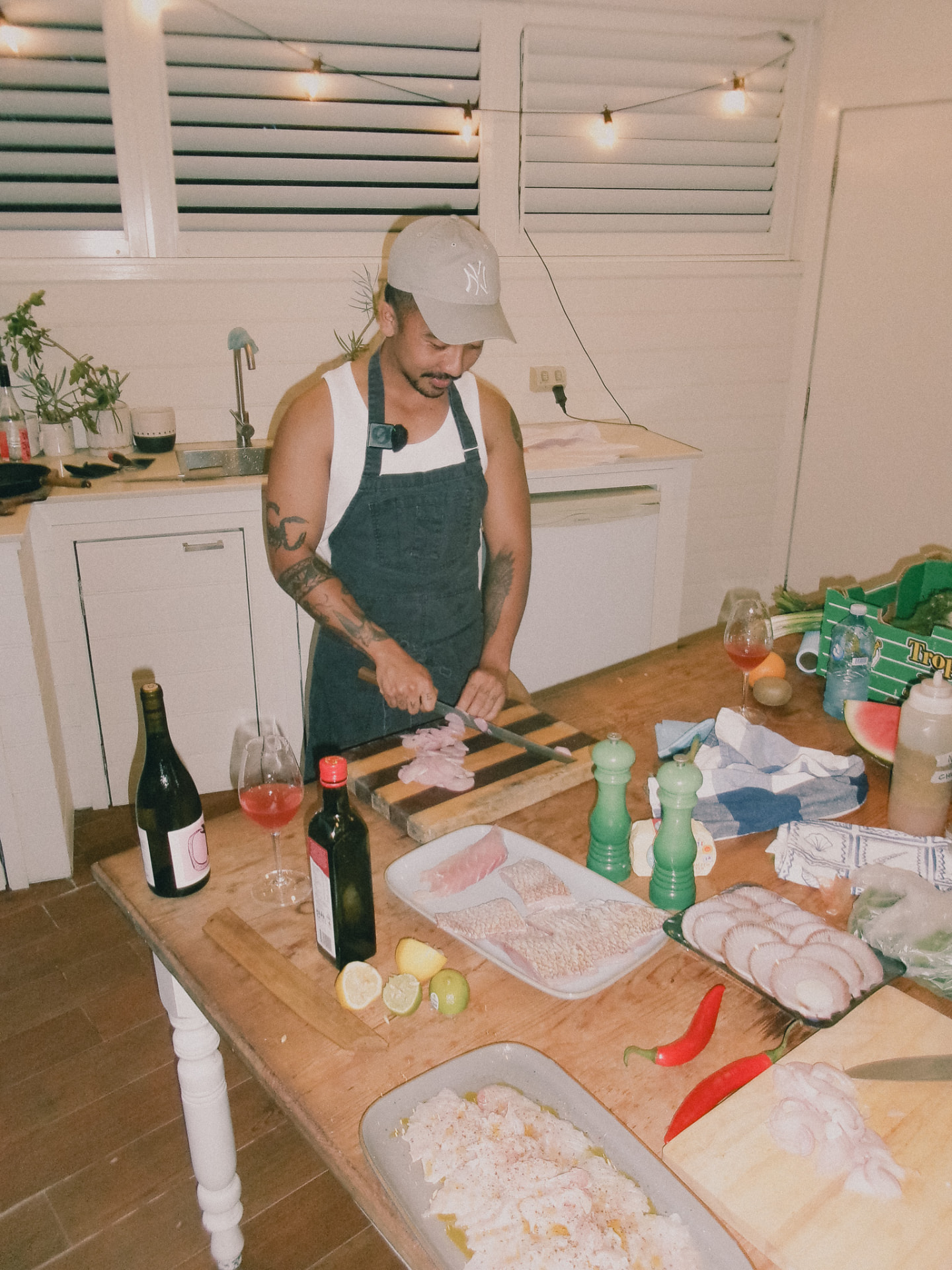 The Boy breaking down fish at the bench